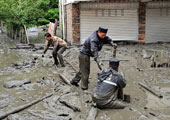 As rain-swollen rivers trigger floods, Sichuan police carry out rescue and relief missions