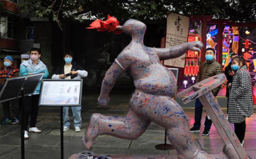 3-meter-high rap pottery figurine on display in Chengdu
